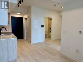 Burlington (Alton) condo for rent - A white room with a sink and a door.