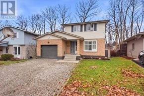 Kitchener apartment for rent - A house with a gravel driveway in front of it.