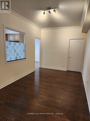 Toronto (Banbury-Don Mills) condo for rent - A room with wood flooring and a window with curtains.