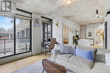 Ottawa condo for rent - A living room with a couch and a chair.