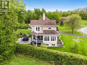 Champlain apartment for rent - A house with a large front yard and a covered patio.