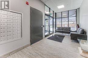 Cambridge house for rent - A brokerage office with a black door and a white wall with a list of names on it.