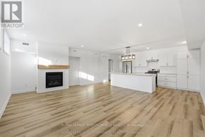 Russell apartment for rent - A spacious living room with a fireplace and hardwood floors.
