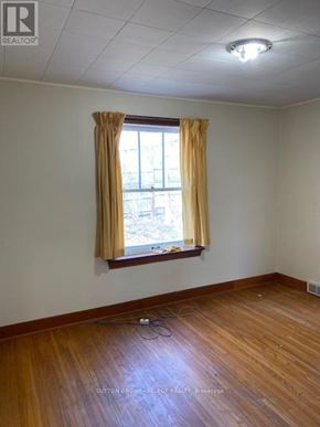 London North (North K) triplex for rent - A room with a window and curtains.