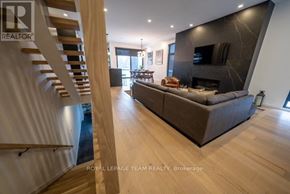 Ottawa apartment for rent - A living room with a couch and a fireplace.