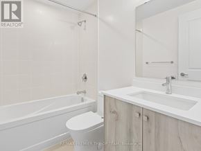 Vaughan (Beverley Glen) condo for rent - A white bathroom with a toilet, sink, and bathtub.