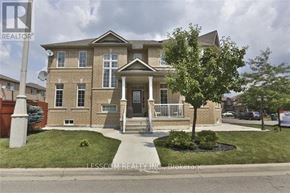 Brampton (Sandringham-Wellington) apartment for rent - A brick house with a tree in front of it.