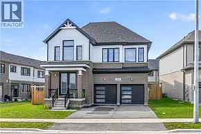 Hamilton apartment for rent - A two-story house with a garage is for sale.