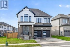 Hamilton apartment for rent - A modern two-story house with a garage is for sale.