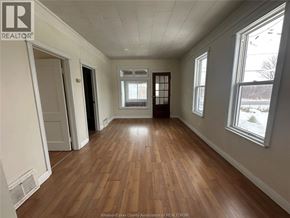 Windsor apartment for rent - A room with wooden flooring and white walls.