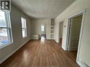 Windsor apartment for rent - A room with wooden floors and white walls.