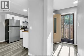 Windsor apartment for rent - A modern kitchen with a refrigerator, stove, and oven.