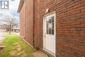 Toronto (Rouge) apartment for rent - A white door is on a brick wall.