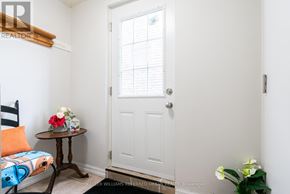 Toronto (Rouge) apartment for rent - A small room with a white door and a table with flowers on it.