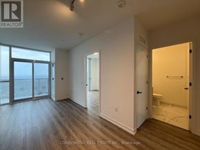 Vaughan (Vaughan Corporate Centre) condo for rent - A room with a sliding glass door leading to a balcony.
