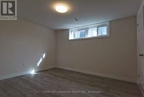 Newmarket (Huron Heights-Leslie Valley) apartment for rent - A room with a window and a door is shown.