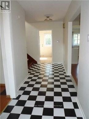 Toronto (Bayview Woods-Steeles) apartment for rent - A long hallway with black and white checkered flooring.