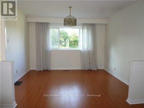 Toronto (Bayview Woods-Steeles) apartment for rent - A room with wooden floors and white walls.