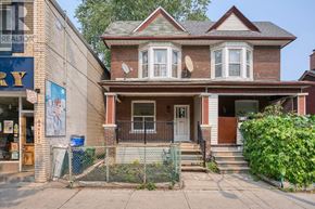 Toronto (South Riverdale) apartment for rent - A house with a brown roof and a white door is in front of a building with a sign that says "REALTOR".