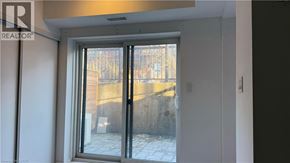 Kitchener townhouse for rent - A realtor photo of a room with a glass door leading to a balcony.