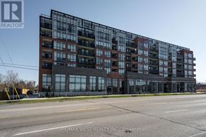 Barrie (Painswick South) condo for rent - A modern multi-story building with a glass facade is the main focus of the image.