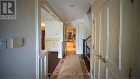 Toronto (Newtonbrook East) apartment for rent - A hallway with a carpeted floor and white walls.