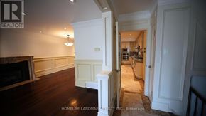 Toronto (Newtonbrook East) apartment for rent - A brokerage office for real estate with a fireplace and wood floors.