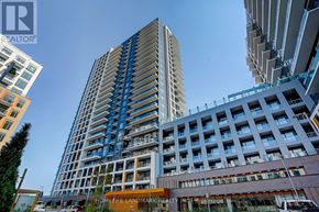 Vaughan (Beverley Glen) condo for rent - A tall building with a blue and white facade stands in front of other buildings.