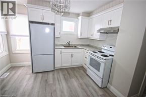Hamilton apartment for rent - A kitchen with a refrigerator, stove, and sink.