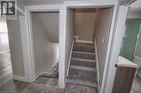 Hamilton apartment for rent - A stairway with a carpeted floor leads to a second floor.