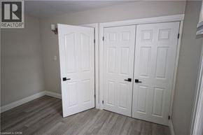 Hamilton apartment for rent - A room with two white doors and a wooden floor.