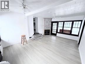 Fort Erie apartment for rent - A room with a wooden floor and a ceiling fan.