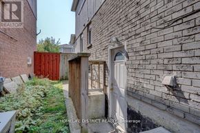 Pickering (Village East) apartment for rent - A realtor brokerage sign is on a brick wall.