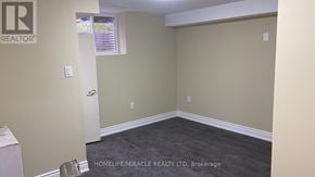 Kitchener apartment for rent - A room with a white door and a window with blinds.
