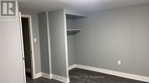 Kitchener apartment for rent - A room with a door and a wall with a sign that says REALTOR.