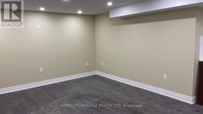 Kitchener apartment for rent - A room with a carpeted floor and beige walls.