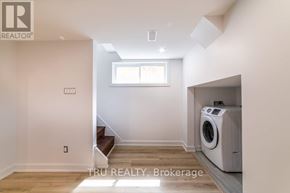 Ottawa apartment for rent - A room with a washing machine in it.