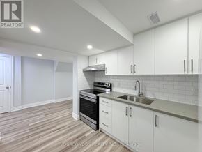 Markham (Middlefield) apartment for rent - A kitchen with white cabinets and a stainless steel sink.