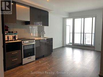 Toronto (Church-Yonge Corridor) condo for rent - A kitchen with a stove top oven and a refrigerator.