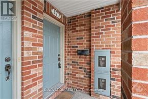 Ottawa townhouse for rent - A blue door is on the left and a grey box is on the right.