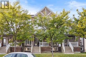 Ottawa townhouse for rent - A white car is parked in front of a house with a tree in front of it.