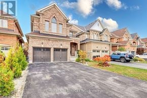 Innisfil (Alcona) apartment for rent - A large, well-maintained house with a driveway in front.