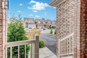 Innisfil (Alcona) apartment for rent - A view from a balcony overlooking a residential area with houses and trees.