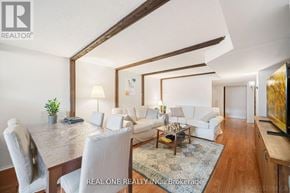 Richmond Hill (Crosby) apartment for rent - A well-lit, modern living room with a dining table and white furniture.