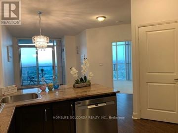 Mississauga (City Centre) condo for rent - A kitchen with a sink, a window, and a chandelier.