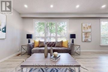 Aurora (Aurora Heights) apartment for rent - A living room with a grey couch and a coffee table in front of it.
