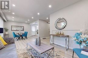 Aurora (Aurora Heights) apartment for rent - A well-lit living room with a dining area in the background.