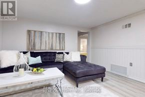 Aurora (Aurora Heights) apartment for rent - A living room with a grey couch and a white coffee table.