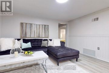 Aurora (Aurora Heights) apartment for rent - A living room with a grey couch and a white coffee table.