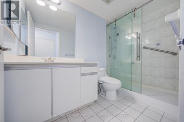 Vaughan (Crestwood-Springfarm-Yorkhill) condo for rent - A kitchen with white cabinets and a checkered floor.